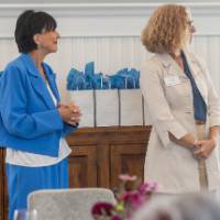 faculty standing in front of room